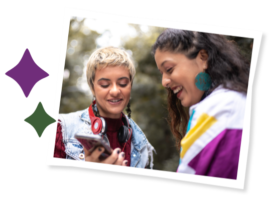 Two young people looking at a phone